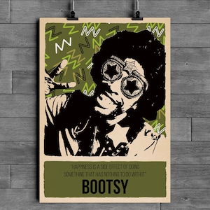 May include: A poster featuring a black and white illustration of Bootsy Collins wearing star-shaped glasses. The background has green zig-zag patterns. The poster includes the quote: "Happiness is a side effect of doing something that has nothing to do with it."