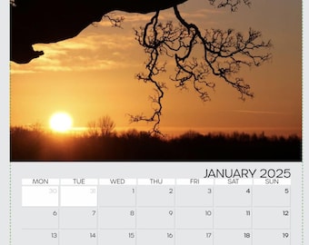 May include: A calendar for January 2025 with a sunset photo of a tree silhouetted against a bright orange sky. The text "Sunrise at Bradgate Park Leics suzieallen40@btinternet.com" is at the bottom of the calendar.