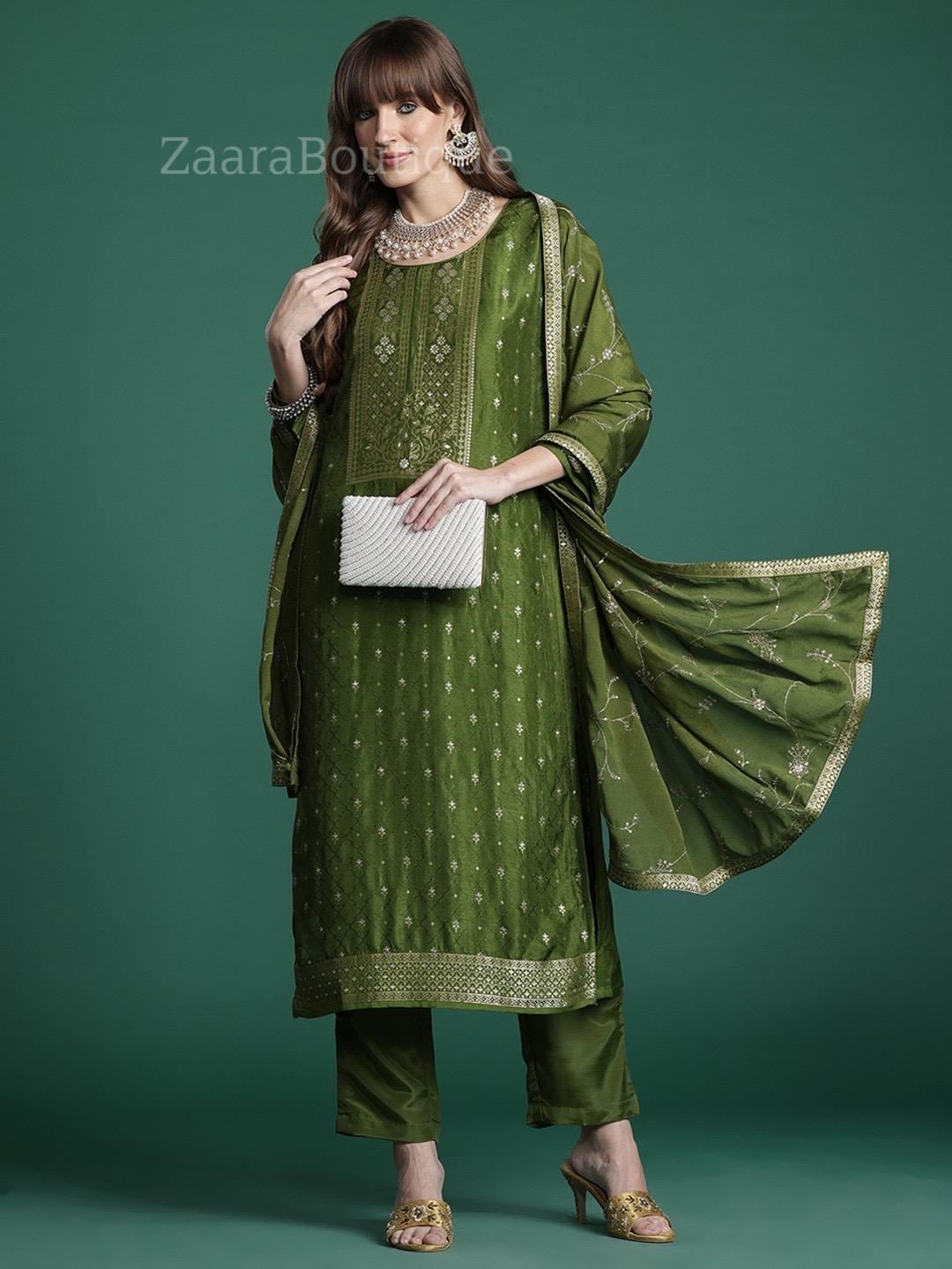 olive green indian dress Draped in elegance, this olive green sharara set is where tradition meets effortless grace. The rich earthy hue, paired with delicate detailing, brings out a timeless charm that feels both rooted and