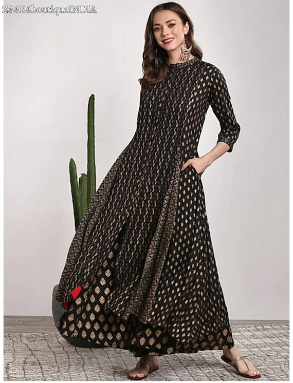 Kurtis on top black palazzo