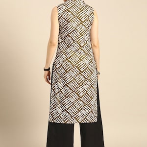 May include: A sleeveless white and brown geometric patterned kurta with a mandarin collar and a black palazzo pant.