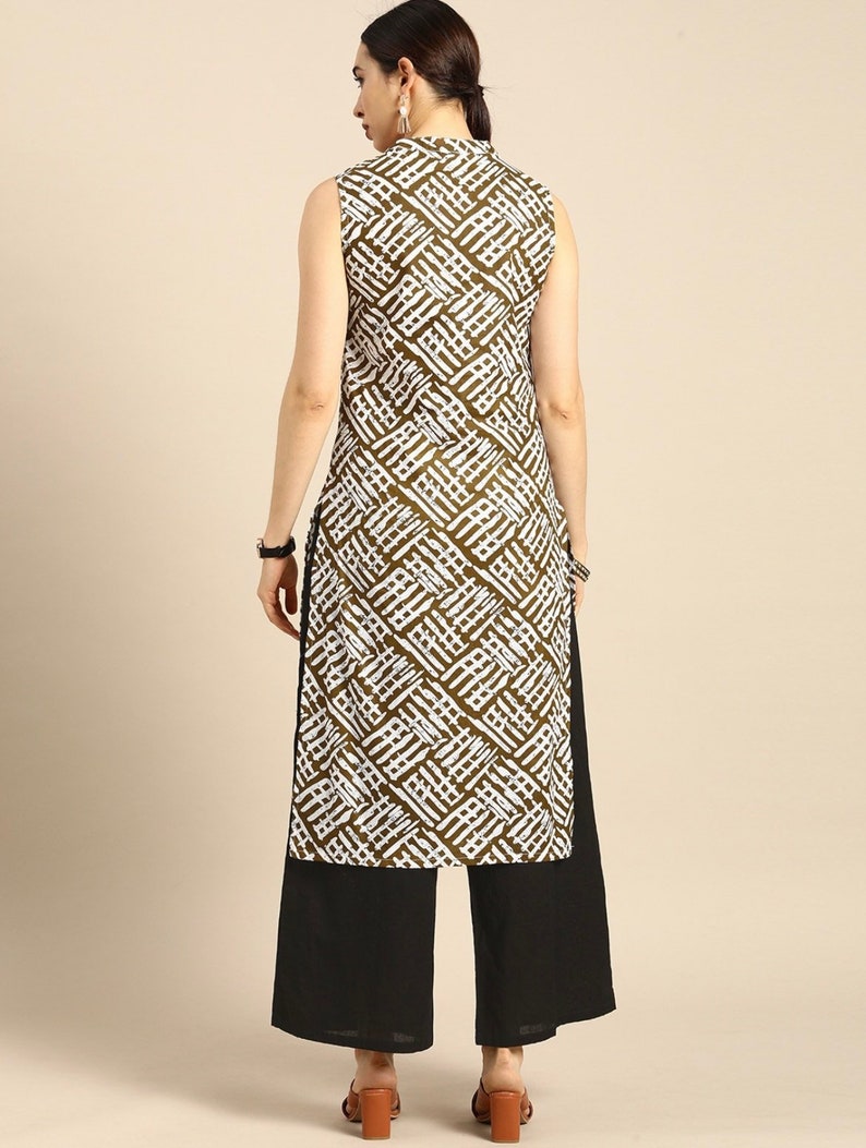 May include: A sleeveless white and brown geometric patterned kurta with a mandarin collar and a black palazzo pant.