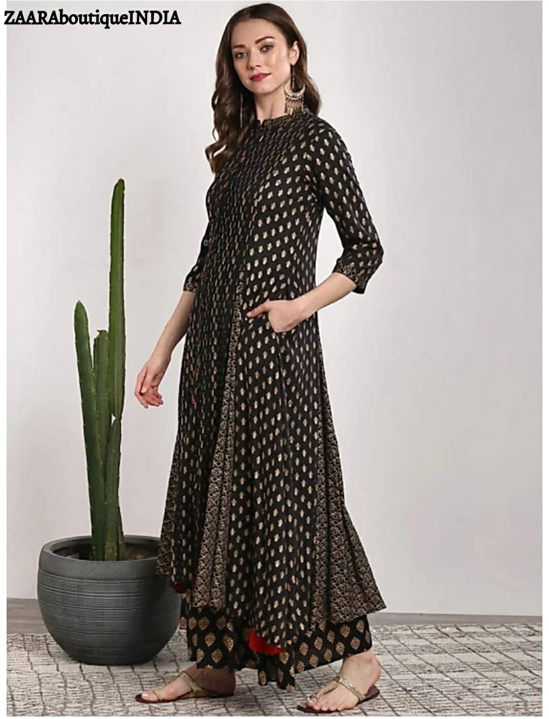 Kurtis on top black palazzo