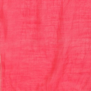 May include: A bright pink fabric with a subtle sheen. The fabric has a thin, silver-colored border.
