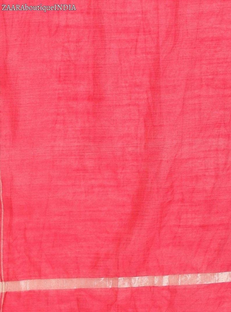 May include: A bright pink fabric with a subtle sheen. The fabric has a thin, silver-colored border.