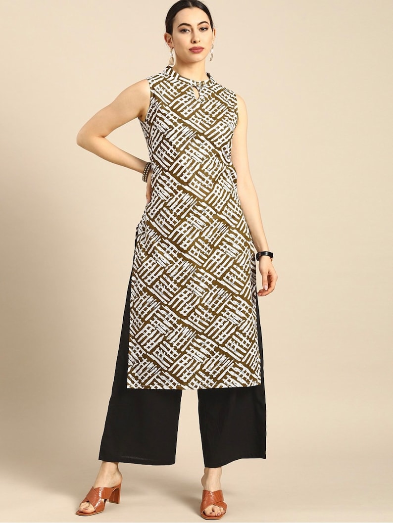 May include: A sleeveless green and white patterned kurta with a keyhole neckline. The kurta is paired with black palazzo pants.