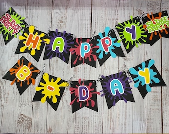 May include: A black and white banner with colorful paint splatters and the words "Slime Party" and "Happy Birthday".