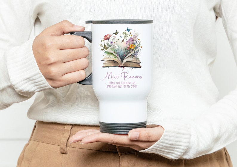 May include: White travel mug with a floral design and an open book. The text on the mug reads "Miss Reeves Thank you for being an important part of my story."
