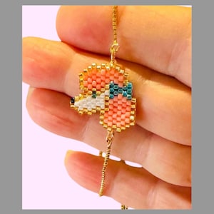 Handcrafted Beaded Mini Poodle Dog Face Bracelet with Adjustable Slider - Gold Chain with Pink Beads and Turquoise Eyes - Dog Lover Gift