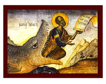 May include: A religious icon depicting Jonah being swallowed by a large fish. The icon is painted in a traditional style with vibrant colours and gold accents. The text on the scroll reads "εκ κοιλίας θαλασσης λατομι", which translates to "from the belly of the sea, a tomb."