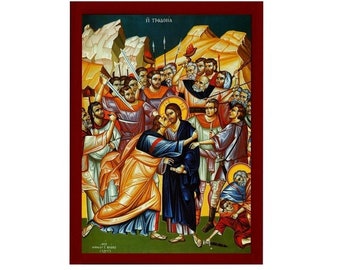 May include: A colourful Byzantine icon depicting the Kiss of Judas, a scene from the Passion of Christ. Jesus is shown in blue robes, while Judas is in yellow robes. The icon is set against a background of rocky hills and a blue sky.
