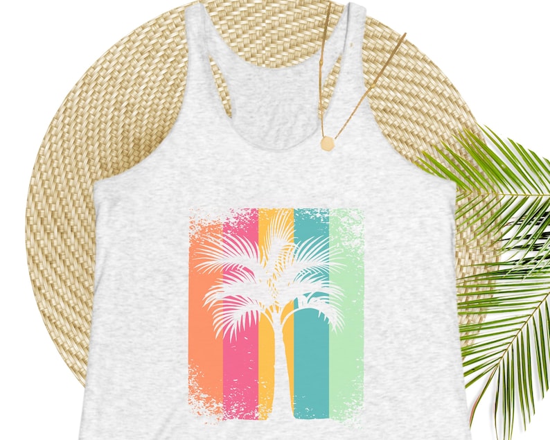 A white heathered tank top with a distressed, retro-style palm tree graphic on stripes of shades of pink, orange, yellow, green, and blue.