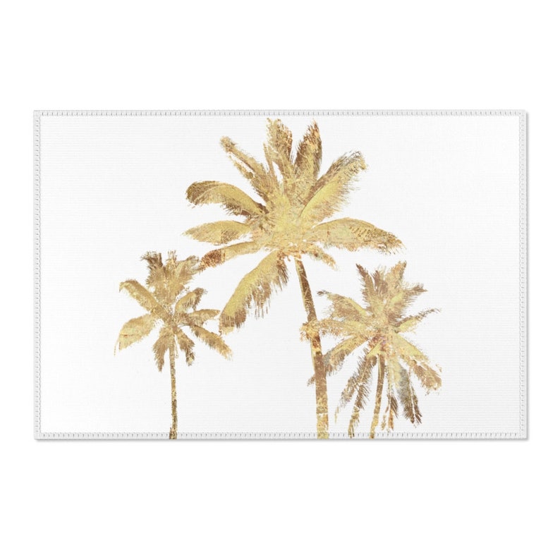 Three gold colored palm trees on a white background throw rug.