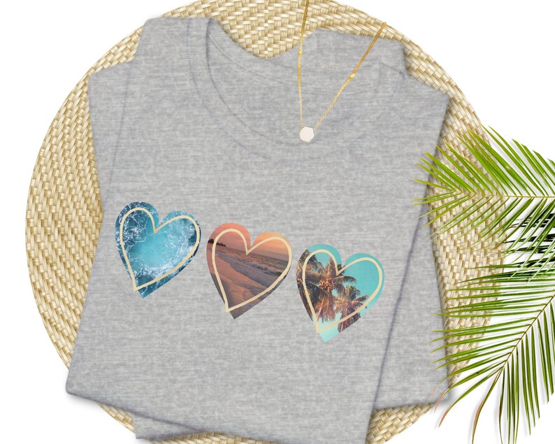 Athletic heather gray tshirt with 3 hearts with ocean scenes in each heart.