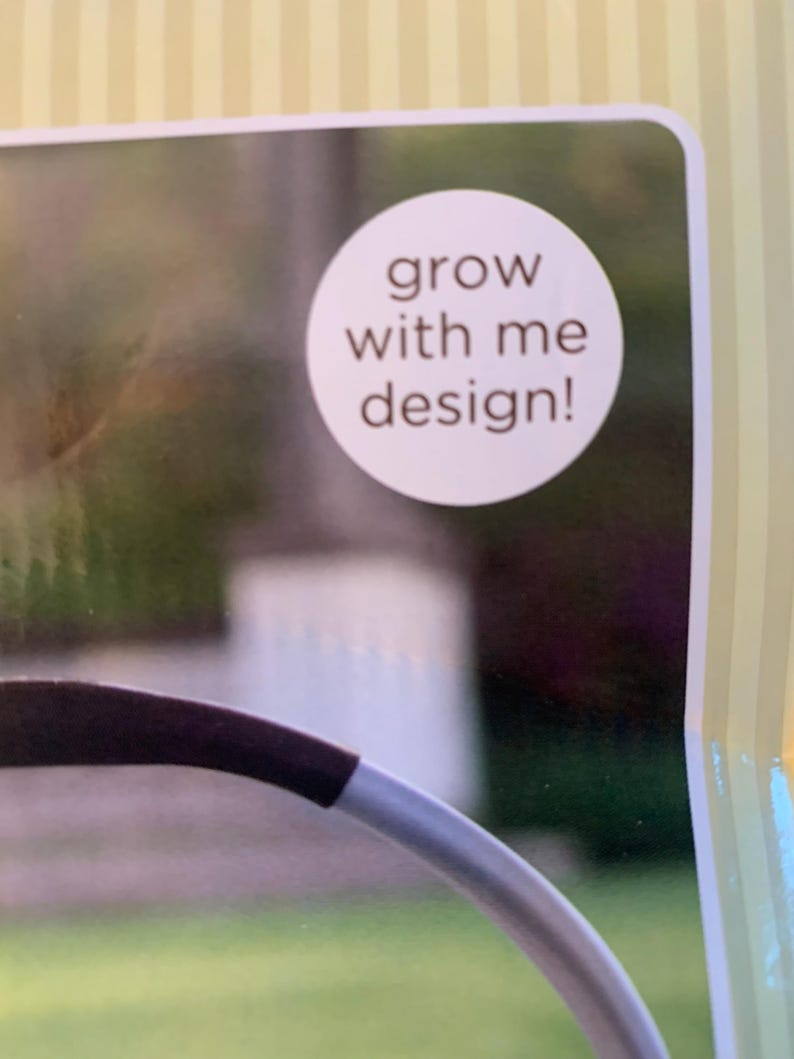 May include: A white circle with the text 'grow with me design!' in brown text.