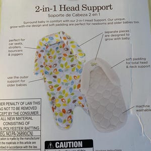 May include: A white and green 2-in-1 head support for babies. The head support is made of soft padding and has a grow-with-me design. The product is machine washable and is designed for use in car seats, strollers, bouncers, and joggers. The product is made by Carter's and is labeled 'child of mine.' The packaging also includes a warning label that reads 'Caution: Do not allow the use of this product to interfere with proper function of the child safety restraints, according to the manufacturer's instructions.'