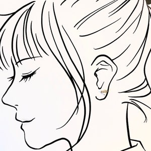 Puede incluir: Un dibujo de l&iacute;nea de un rostro de perfil con un peque&ntilde;o pendiente en la oreja.