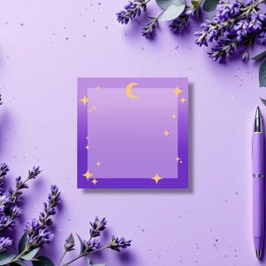 May include: A square, purple sticky note with a gradient center, adorned with a gold crescent moon and stars. A matching purple pen and sprigs of lavender frame the note on a lavender background, creating a cohesive, floral-themed aesthetic.