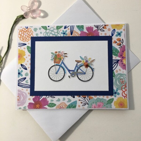 A spring bike ride to take in the fragrant flowers.  A handmade note card that is blank on the inside.  All occasion card.  Free delivery