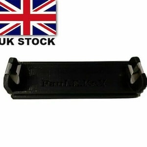 May include: Black plastic cable clip with a silver metal latch. The clip has the text "Panel H.L.K.01" printed on it.
