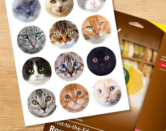 May include: A sheet of 12 round, white, adhesive labels with images of cats. The labels are designed for use with a laser or inkjet printer. The text "Tint-to-the-Edge Round Labels" is printed on the sheet.