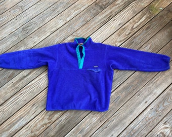 Vintage 90s Patagonia mens fleece large/XL blueberry colored with turquoise trim. Made In the USA.  Chest pocket. Thick and soft.