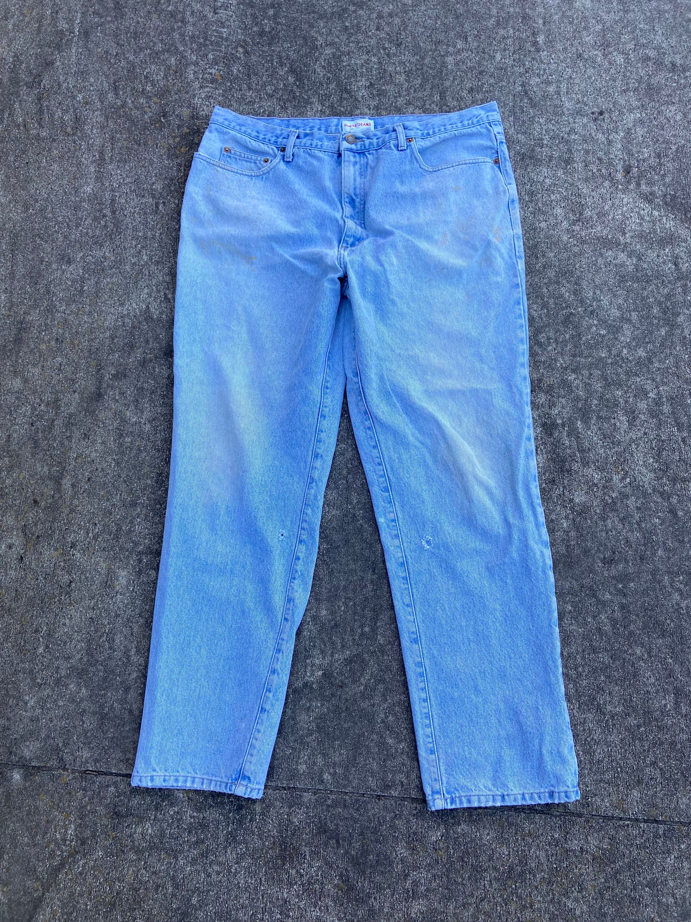 Vintage Guess 38x31 Denim Jeans. 100% Cotton. Zipper Fly. Some Stains and A Few Holes. Made in The USA. Nice Fade.