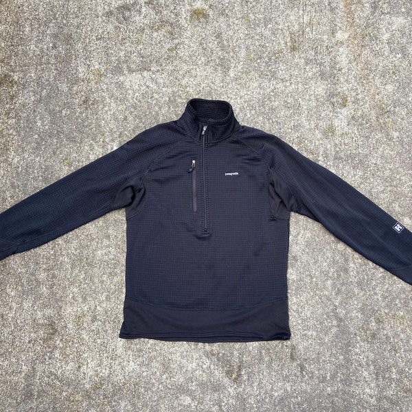 Vintage Patagonia Polartec Regulator Small (tag says medium) black half zip pullover. Chest pocket. Regulator technology. Made in the USA.