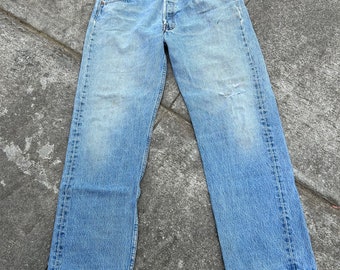 Vintage 90s Levi’s 501 32x29(tag 36x30) button fly 100% cotton denim jeans. Made in the USA 03/1997. Medium wash. Faded. Distressed. Soft