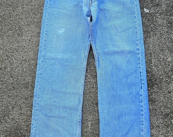 Vintage Levi’s 501 31x28(tag 34x36) button fly 100% cotton denim jeans. Made in the USA 10/1991 Light wash and faded. Incredibly soft.