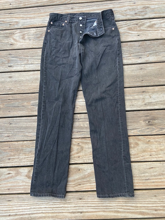 Vintage black 32x34 501 Levi’s denim jeans. Red ta