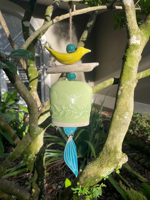 Whimsical Ceramic Wind Bell with Yellow Bird, Leaf, and Driftwood Accent