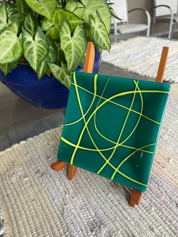 Green glass dish with abstract design