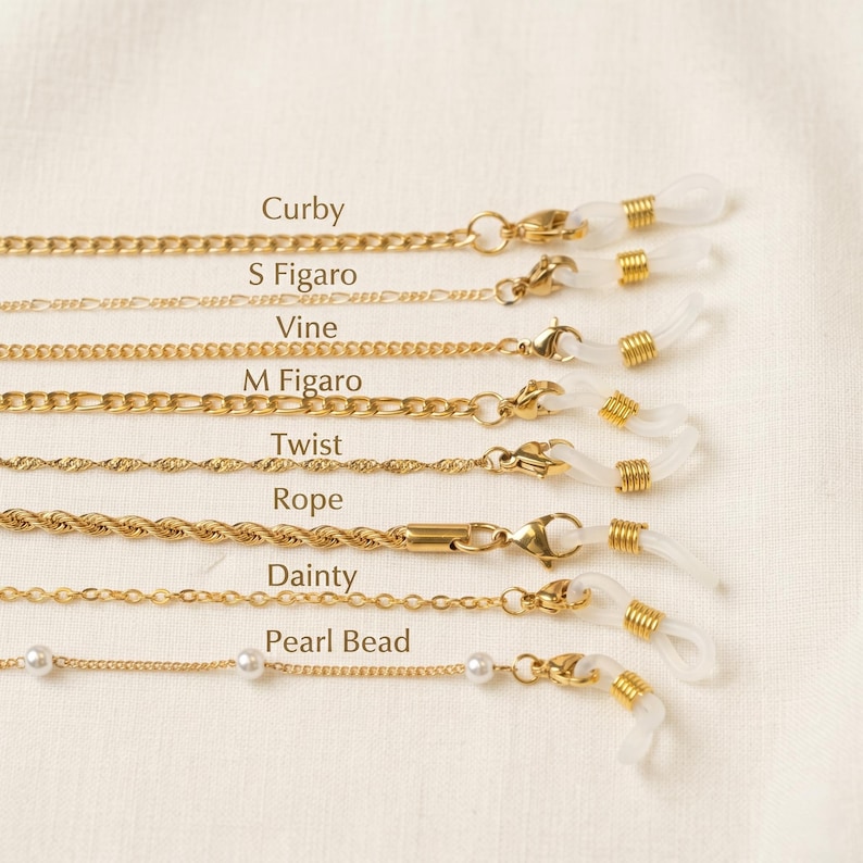 May include: Gold-colored eyeglass chains in various styles, including Curb, S Figaro, Vine, M Figaro, Twist, Rope, Dainty, and Pearl Bead. Each chain has a clasp for attaching to glasses and a loop for the ear pieces.