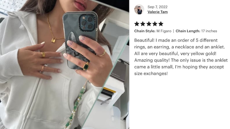 May include: A close-up of a person's hands wearing gold rings and a necklace with a small padlock charm. The person is holding a white iPhone with a marble-patterned case. The image includes a review with the text "Chain Style: M Figaro | Chain Length: 17 inches Beautiful! I made an order of 5 different rings, an earring, a necklace and an anklet. All are very beautiful, very yellow gold! Amazing quality! The only issue is the anklet came a little small, I'm hoping they accept size exchanges!"