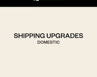 May include: A white background with black text that reads "SHIPPING UPGRADES DOMESTIC" in all caps.