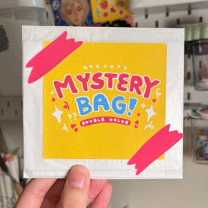 Mysterieuze grabbelton met kleurrijke stickers en prints | Laptopsticker waterfles | Sticker notitieboekje dagboek