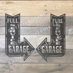 May include: Two black metal signs with white lettering that read "Full Service Garage" with arrows pointing to the right. The signs are on a wood background.