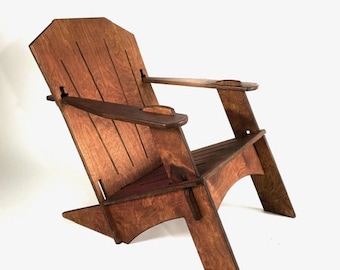 May include: A wooden folding chair with a brown stain finish. The chair has a high back and armrests. The chair is made of plywood and has a simple design.