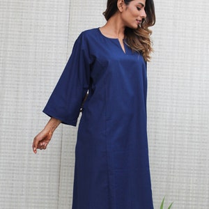 Model is wearing full sleeves blue color dress, Dress has split neck. This is knee length sexy dress. Wear this dress for any occasion. Simple, comfortable, Loungewear dress. Select any color and customize your dress of your choice