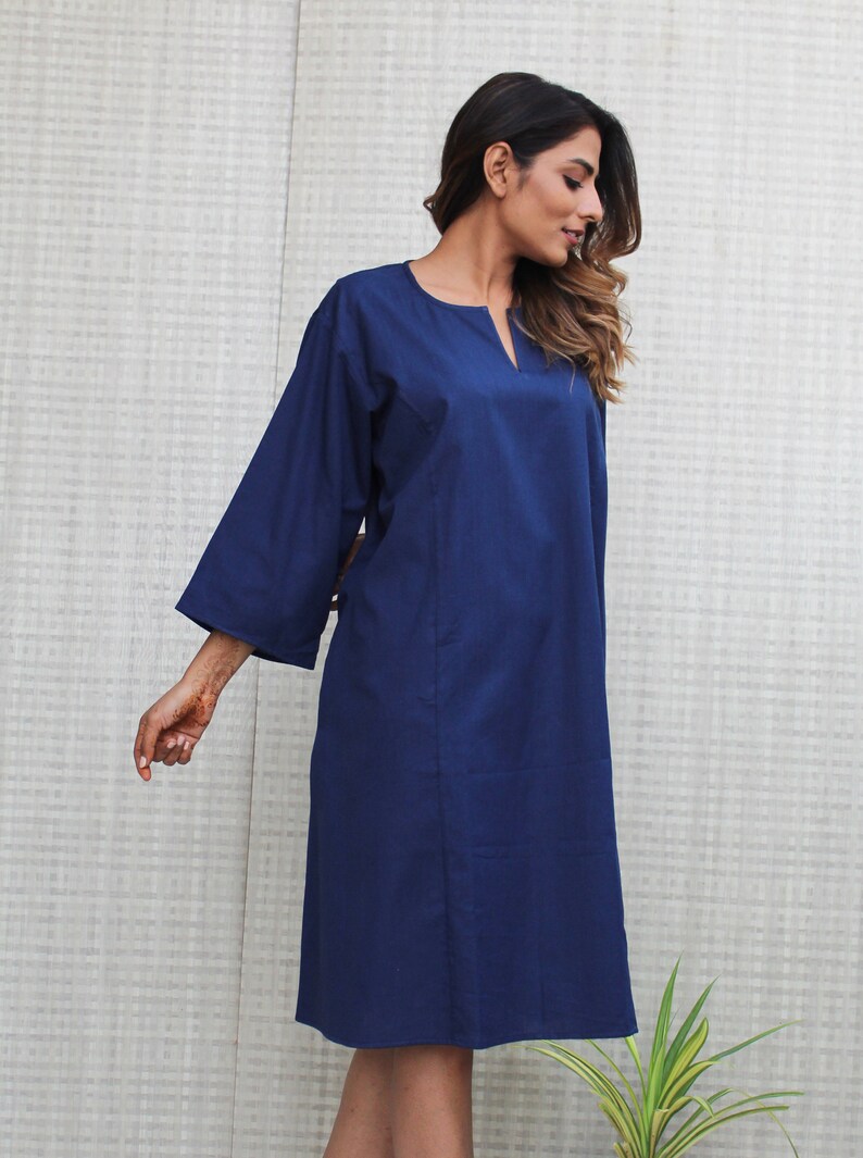 Model is wearing full sleeves blue color dress, Dress has split neck. This is knee length sexy dress. Wear this dress for any occasion. Simple, comfortable, Loungewear dress. Select any color and customize your dress of your choice