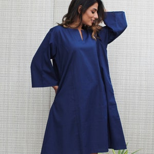 Model is wearing full sleeves blue color dress, Dress has split neck. This is knee length sexy dress. Wear this dress for any occasion. Simple, comfortable, Loungewear dress. Select any color and customize your dress of your choice