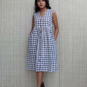 Model is wearing sleeveless Checks dress, Dress has V neckline. This is below knee length sexy dress. Wear this dress for any occasion. Simple, comfortable, Loungewear dress. Select any color and customize your dress of your choice