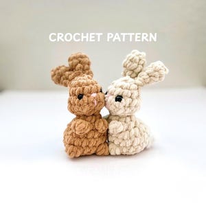 May include: A set of three ceramic mugs with a speckled, matte finish. The mugs are in shades of cream, light gray, and dark gray. Each mug has a simple, minimalist design, perfect for coffee or tea.