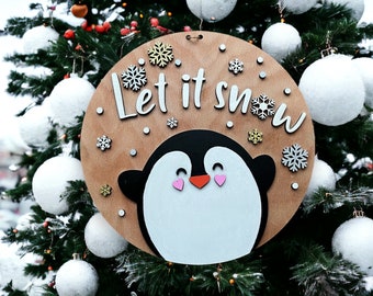 Rundes Holzschild „Let it Snow Penguin“ / handgefertigtes Weihnachtsdekorationsschild für Veranda oder Wand