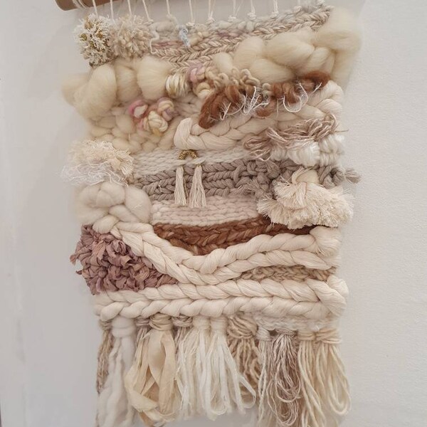 The cinnamon girl weave. Woven wall hanging. Wall art. Boho .pompoms. tapestry. Wall decor