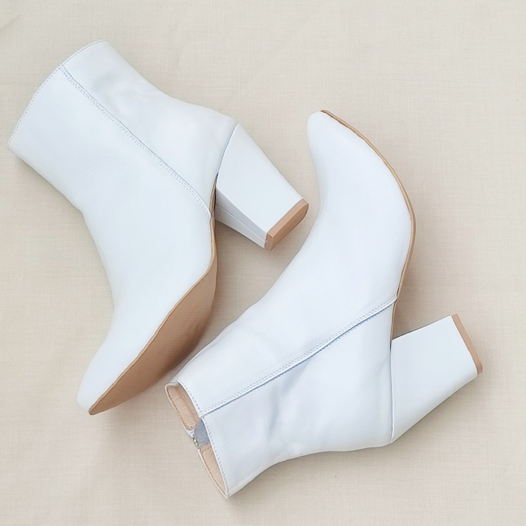 Courrèges Heritage vinyl ankle boots for Women - White in UAE | Level Shoes