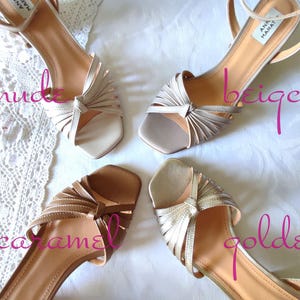 May include: Four pairs of women's sandals in nude, beige, caramel, and golden colors. Each sandal has a strappy design with a knot detail and ankle strap. The sandals are arranged on a white surface.