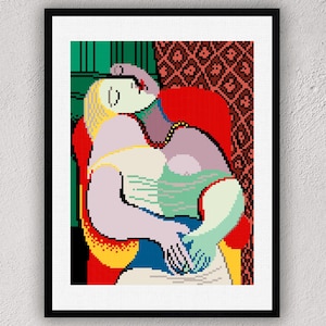 May include: A pixel art print in a black frame depicting a figure with blonde hair resting in a red armchair. The figure has light purple skin and is positioned against a background featuring a green wall and a patterned red curtain.