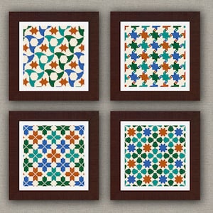May include: Four framed prints with geometric patterns in shades of blue, green, orange, and white. The frames are dark brown wood.